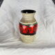 Frieze vase with green and red round