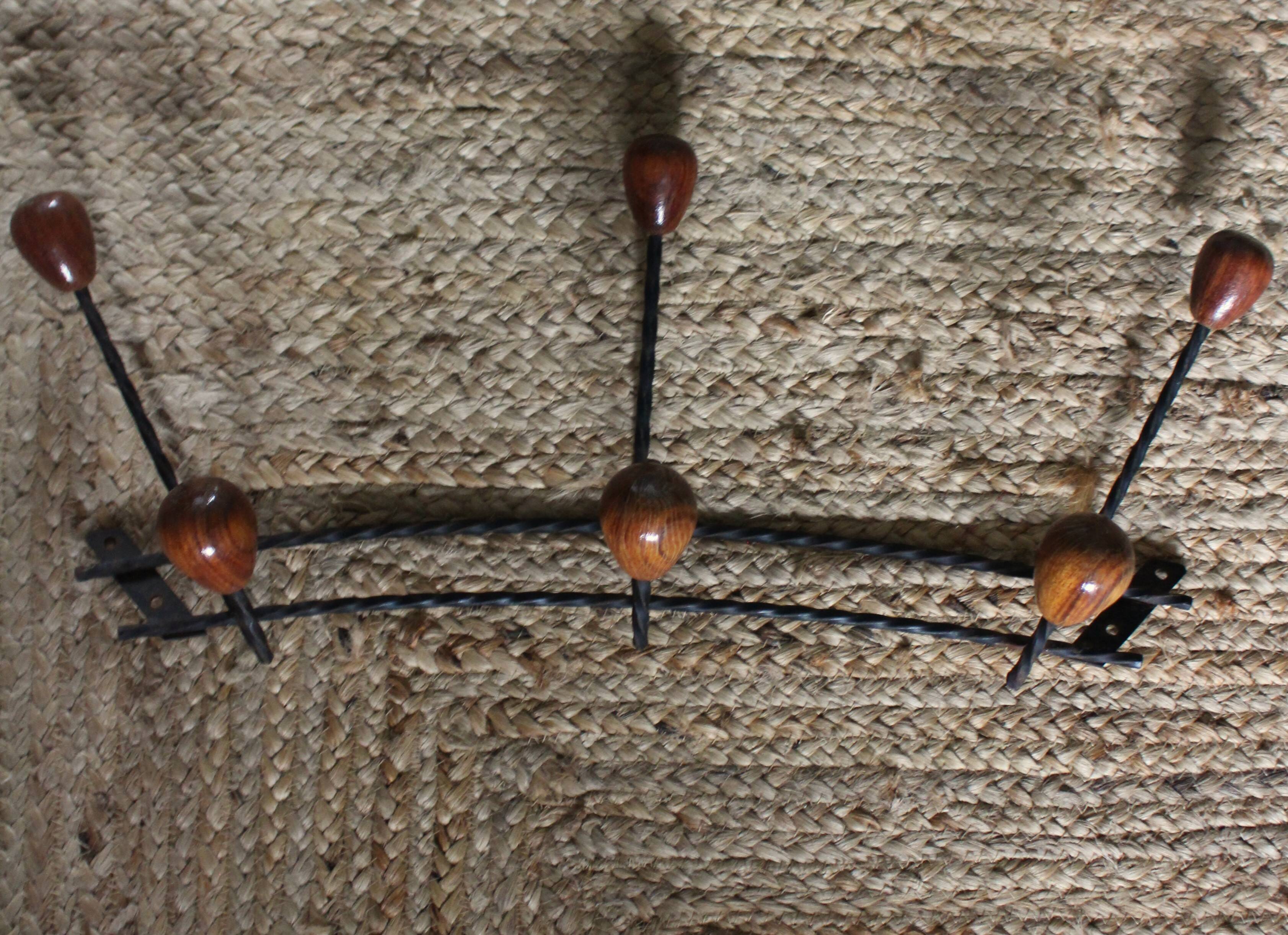 Double wrought iron coat rack with 3 double wooden ball hooks