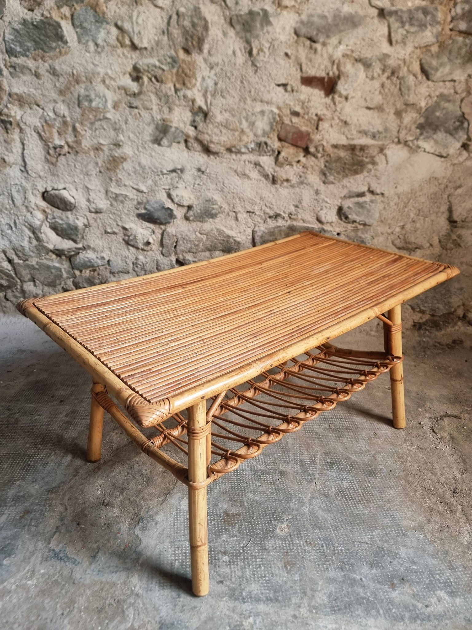 Vintage bamboo and rattan coffee table with magazine rack, French, circa 1960–1970.