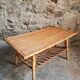 Vintage bamboo and rattan coffee table with magazine rack, French, circa 1960–1970.