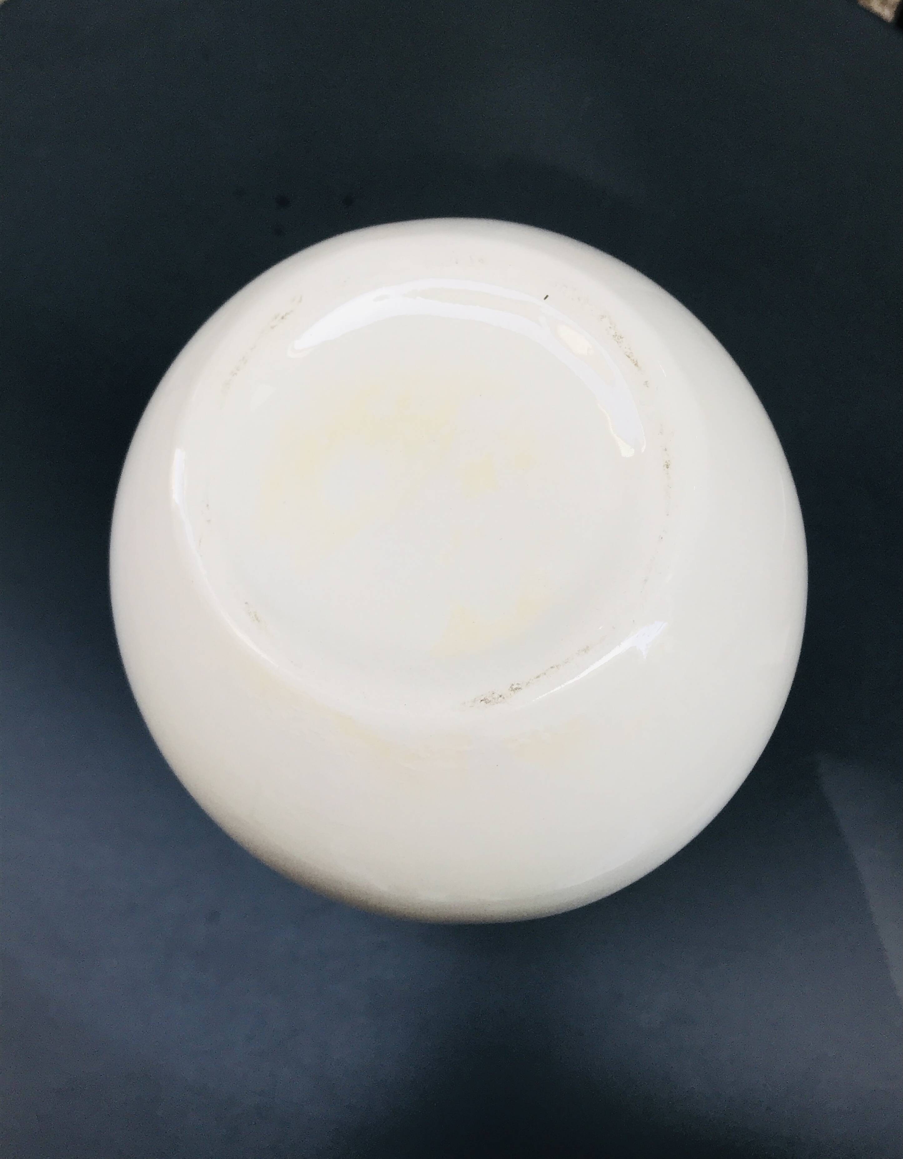 Vase with geometric pattern handles