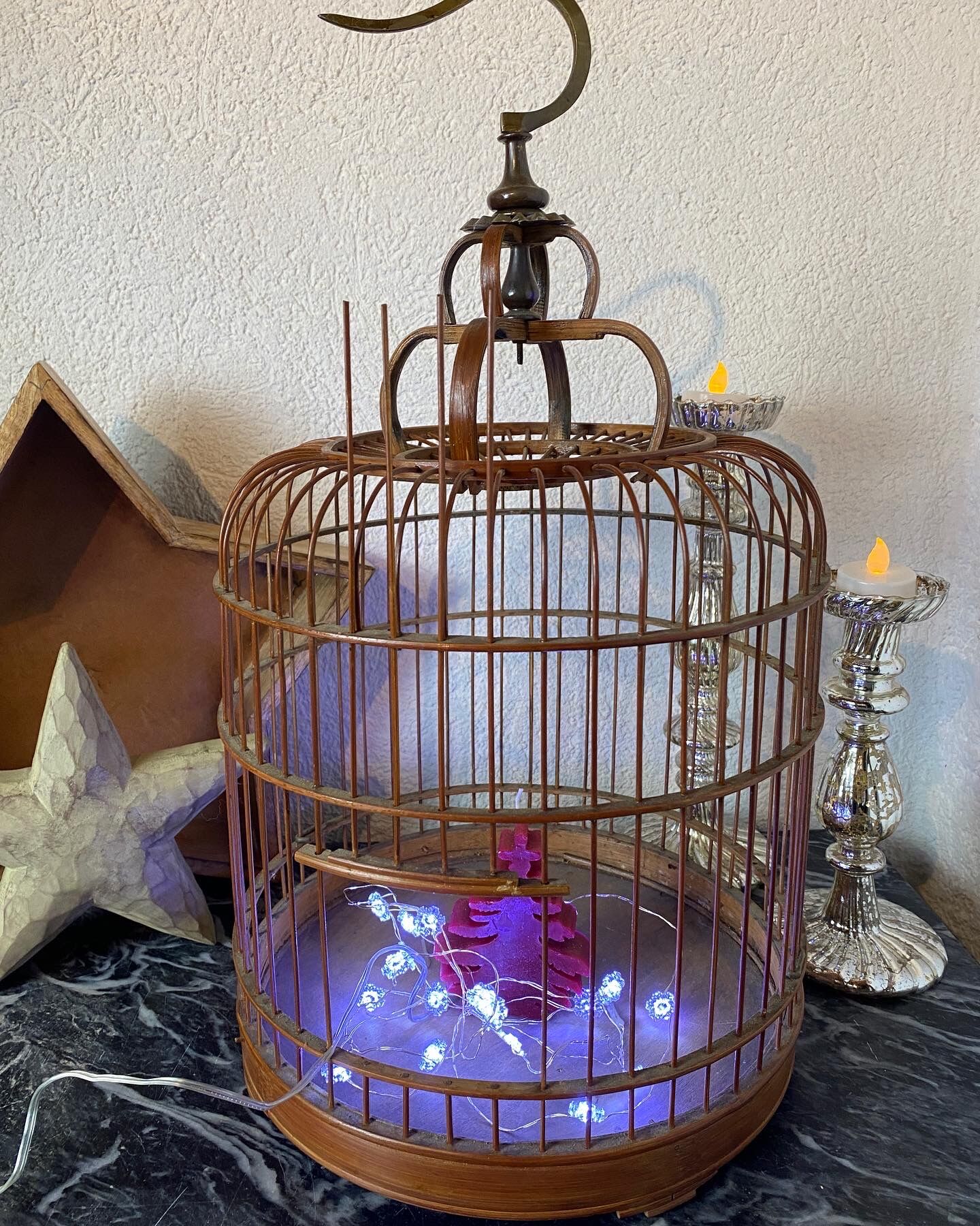 Old bird cage made of bamboo and wood