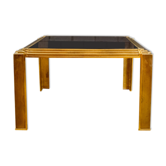 Coffee table made of brass and glass.