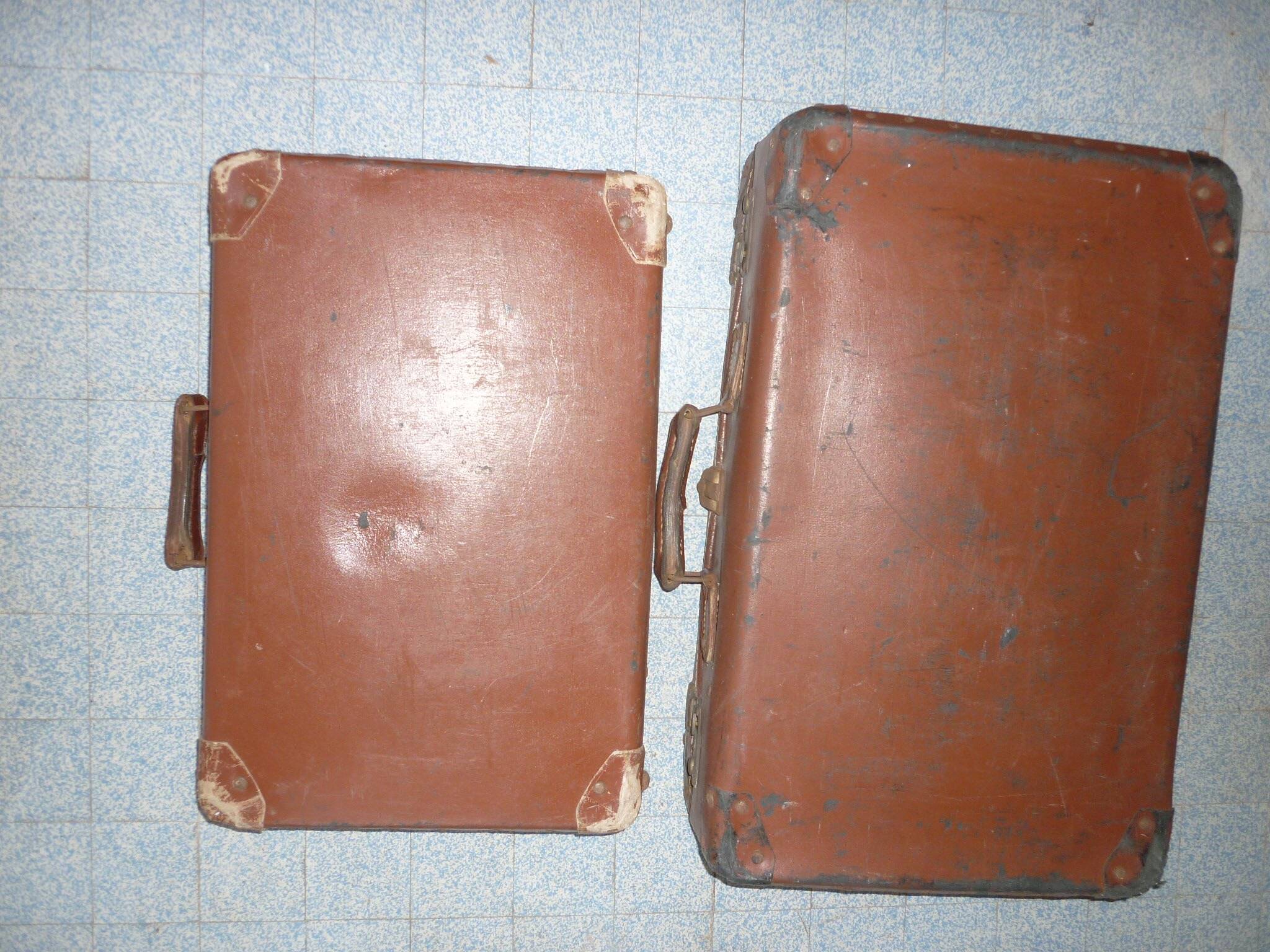 Pair of red suitcases from the 1950s
