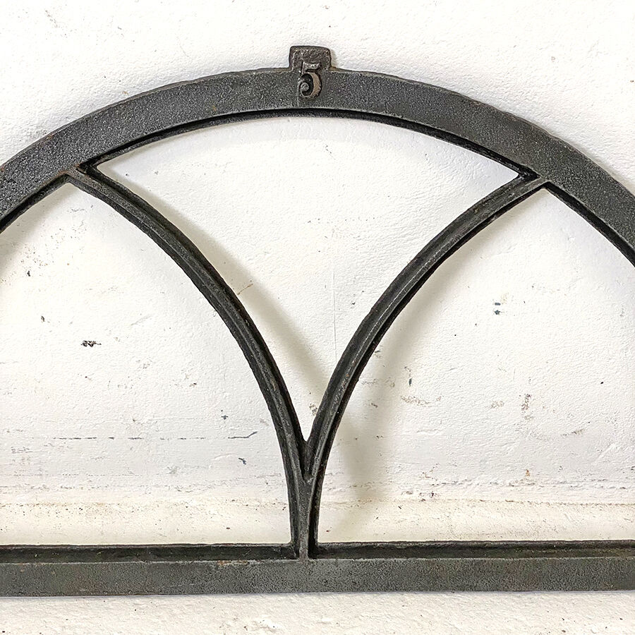 Old arched anthracite grey window