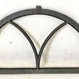 Old arched anthracite grey window