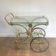 Neo classical style table in silver and gold metal and glass