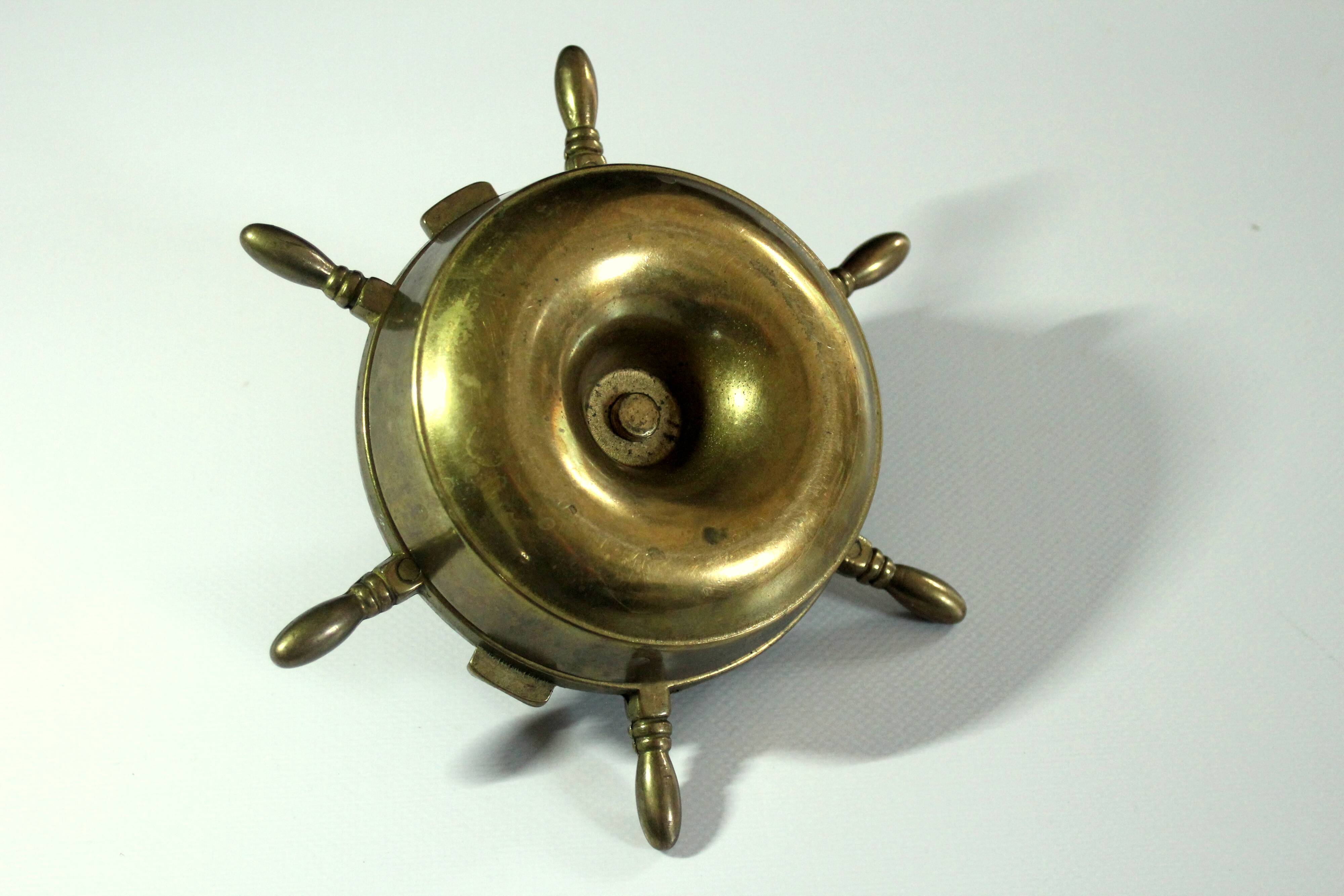 1960s solid brass ashtray in the shape of a steering wheel with a candle stick, vintage