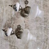 Pair of vintage wall sconces in brass, porcelain, and frosted glass.
