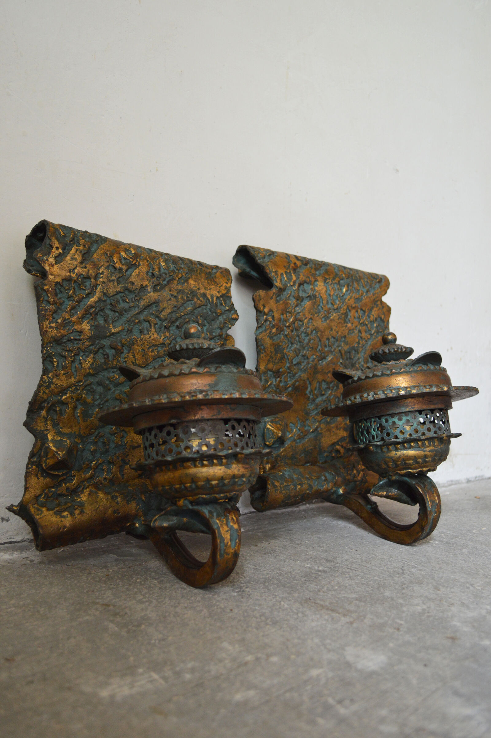Pair of patinated wrought iron sconces