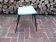 Vintage stool with tapered legs in sky blue faux leather.