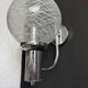 Chrome wall light with blown glass from the 1970s.