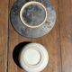 White Indonesian ceramic cup and gray saucer