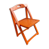 Chaise pliante en bois orange vintage avec un siège à lattes