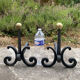 Massive wrought iron chenets from the 19th century topped with brass balls.