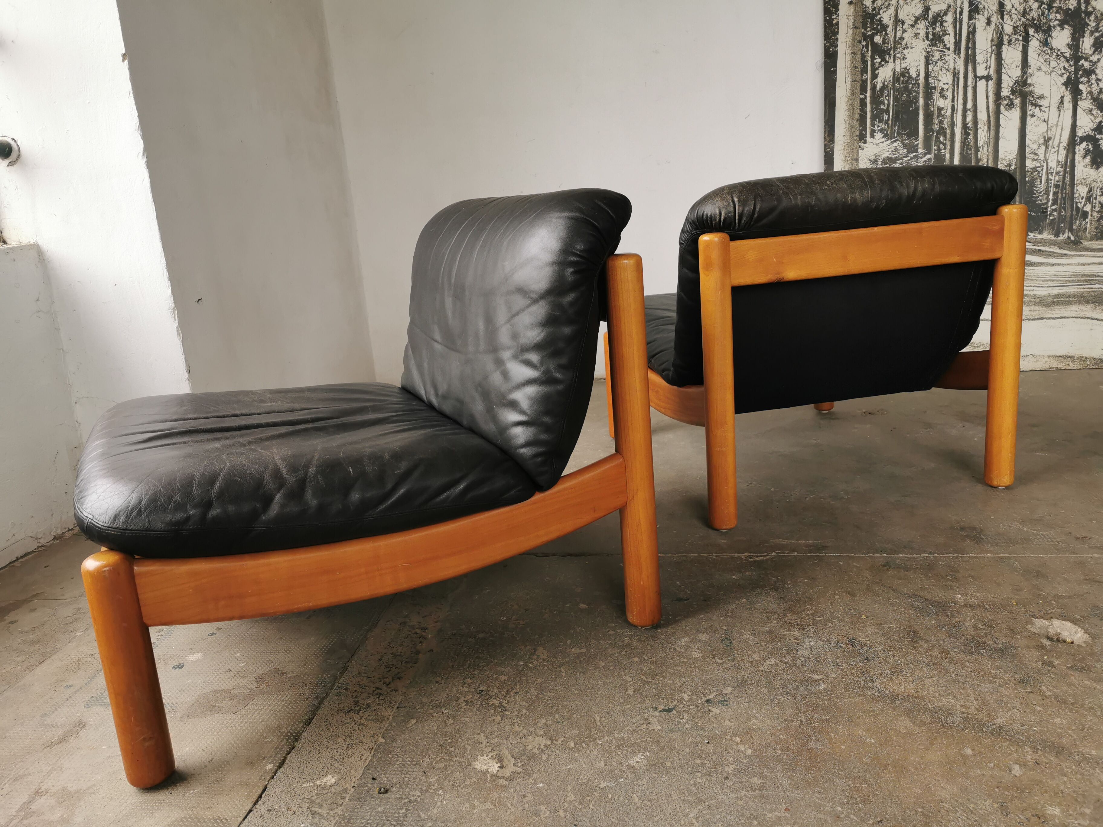 Pair of designer leather armchairs 80s