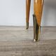 Mid-century nightstands in maple, brass, and glass
