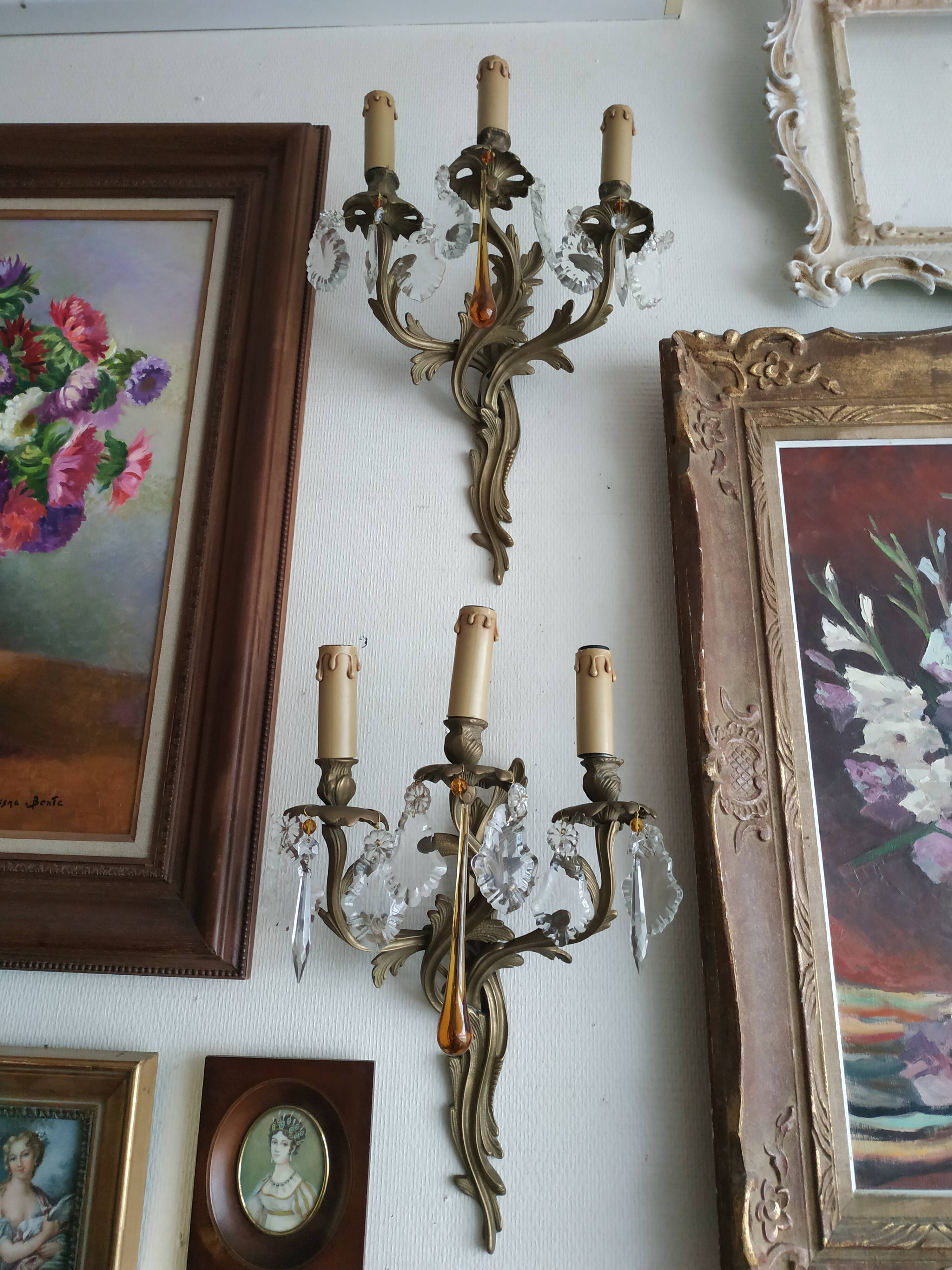 Pair of bronze and crystal sconces