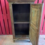India. Bonnetière with a teak door finely carved by hand.