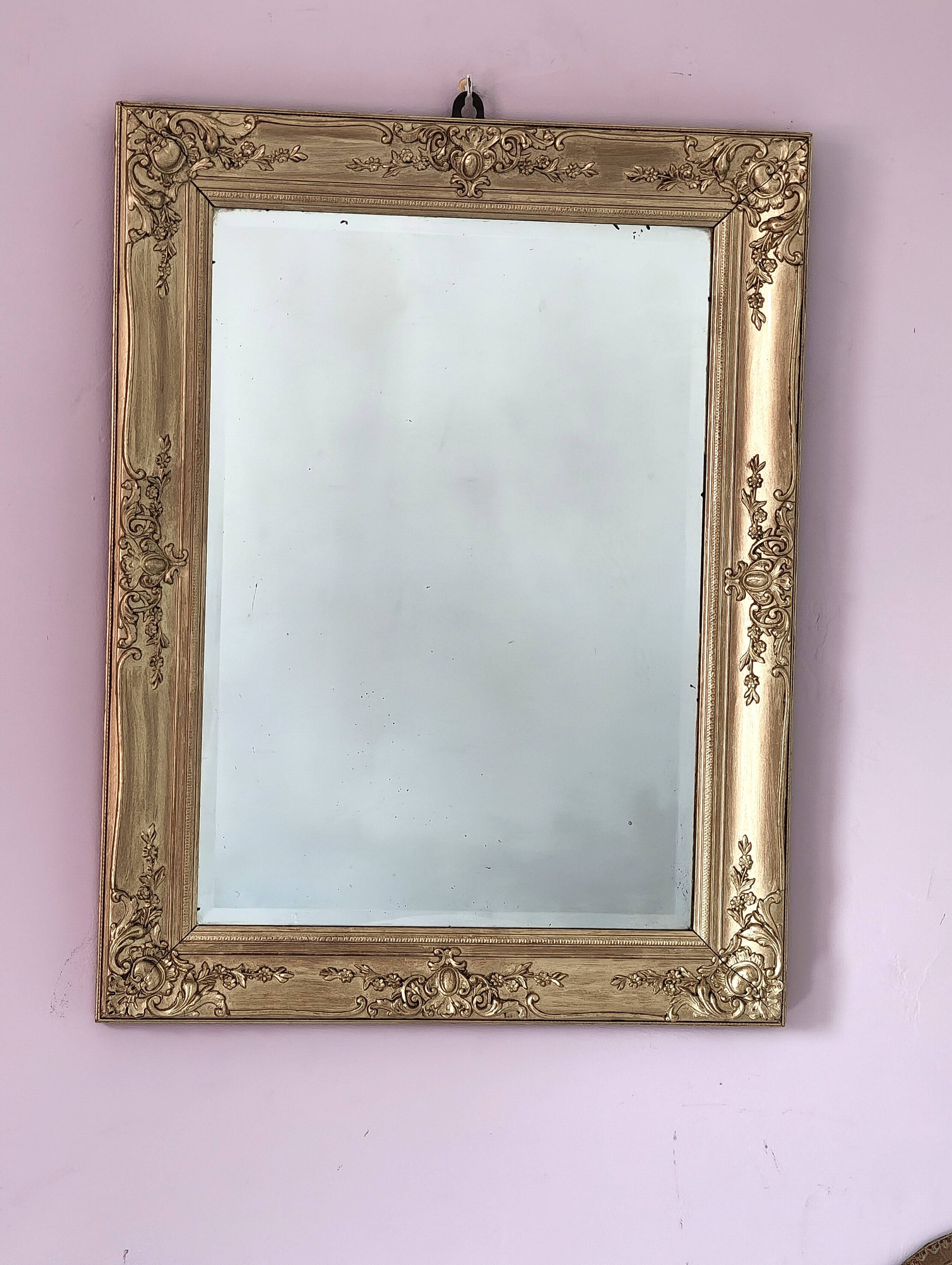 Richly carved antique gilded mirror