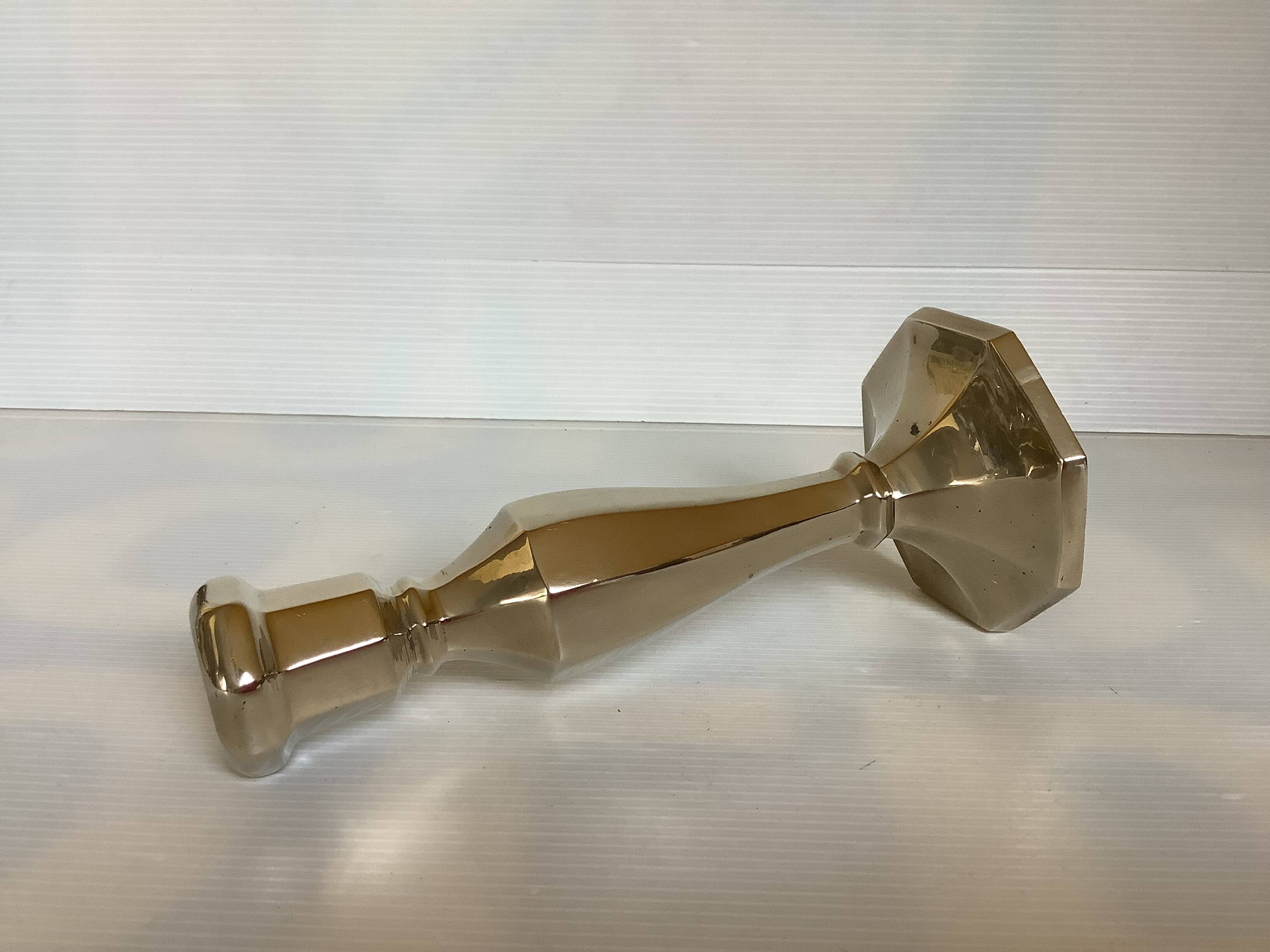 Faceted brass candle holder