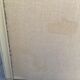 Patinated wood and linen headboard