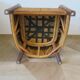 Colonial style armchair in woven rattan and exotic wood