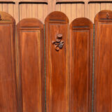 Art Deco screen with 7 panels carved with the insignia of the Foreign Legion, circa 1940