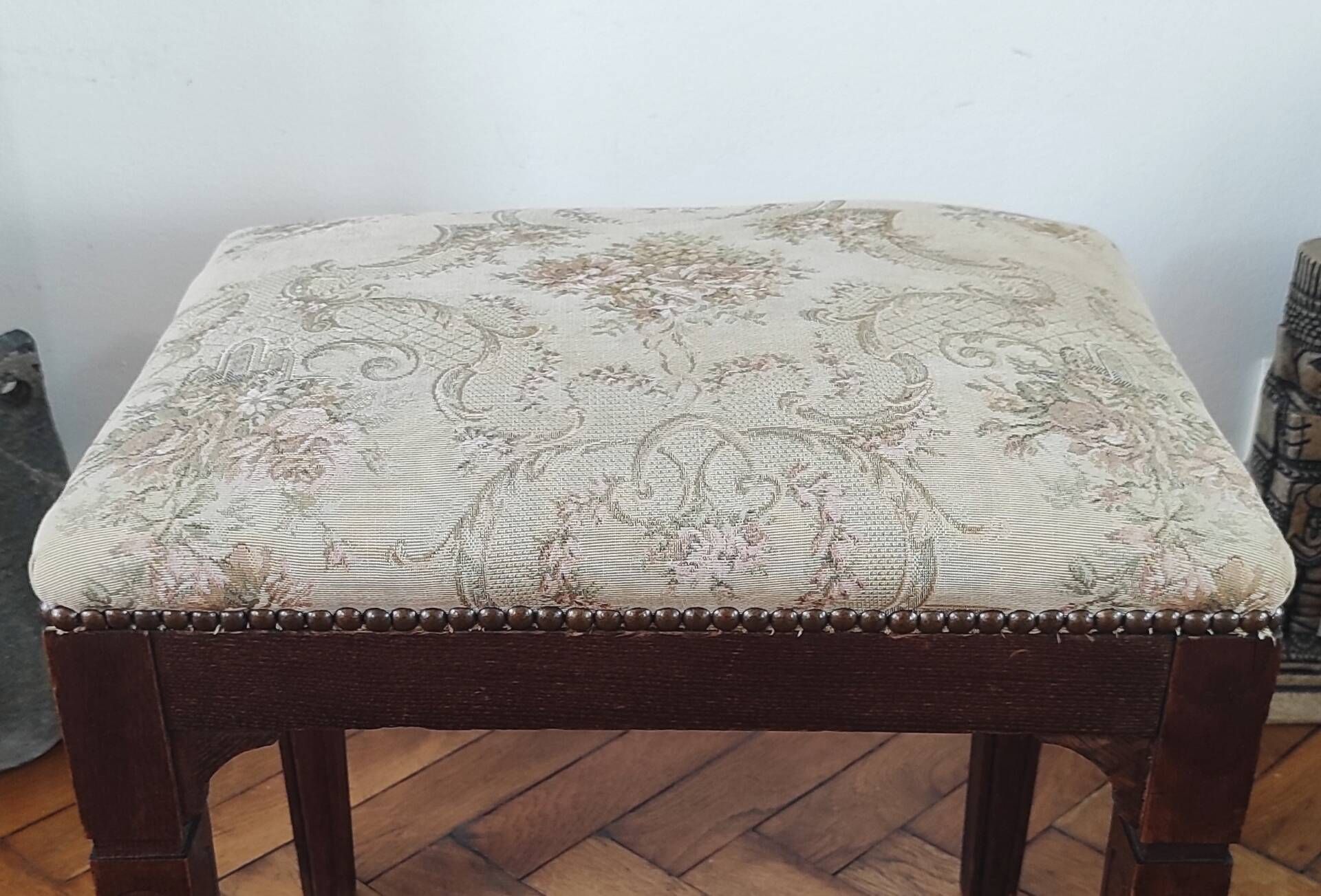 Footrest, vintage stool in solid oak with floral upholstery.