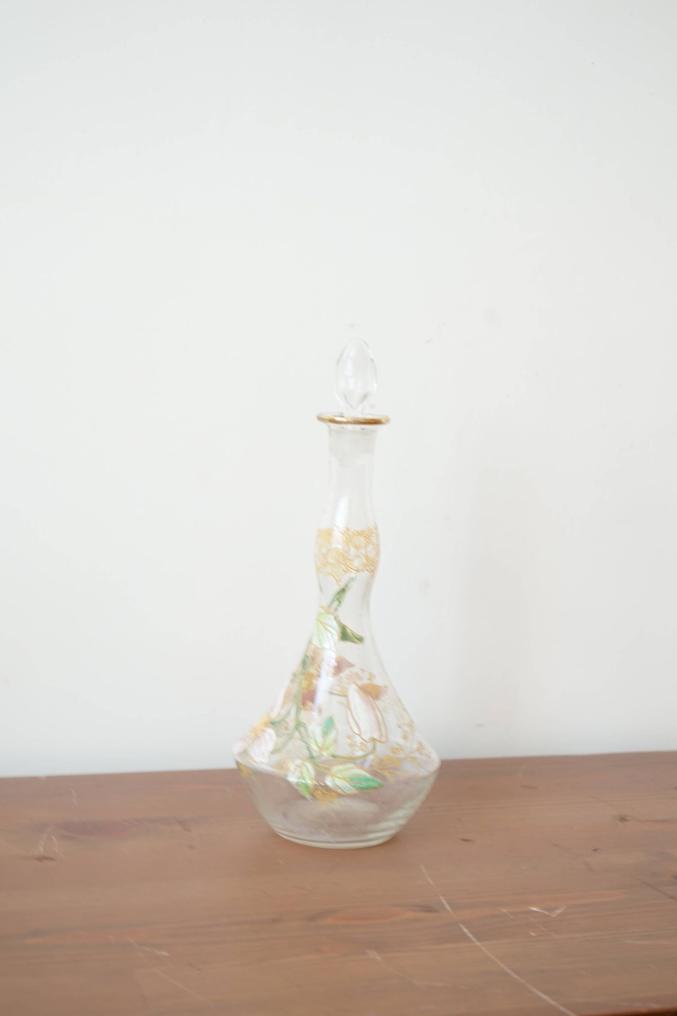 Legras (late 19th century) liqueur carafe in enamelled glass with floral decoration.