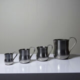 Set of 4 vintage bar measures in brushed stainless steel from the 60s-70s.
