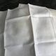 White damask table service consisting of a large tablecloth and 12 napkins