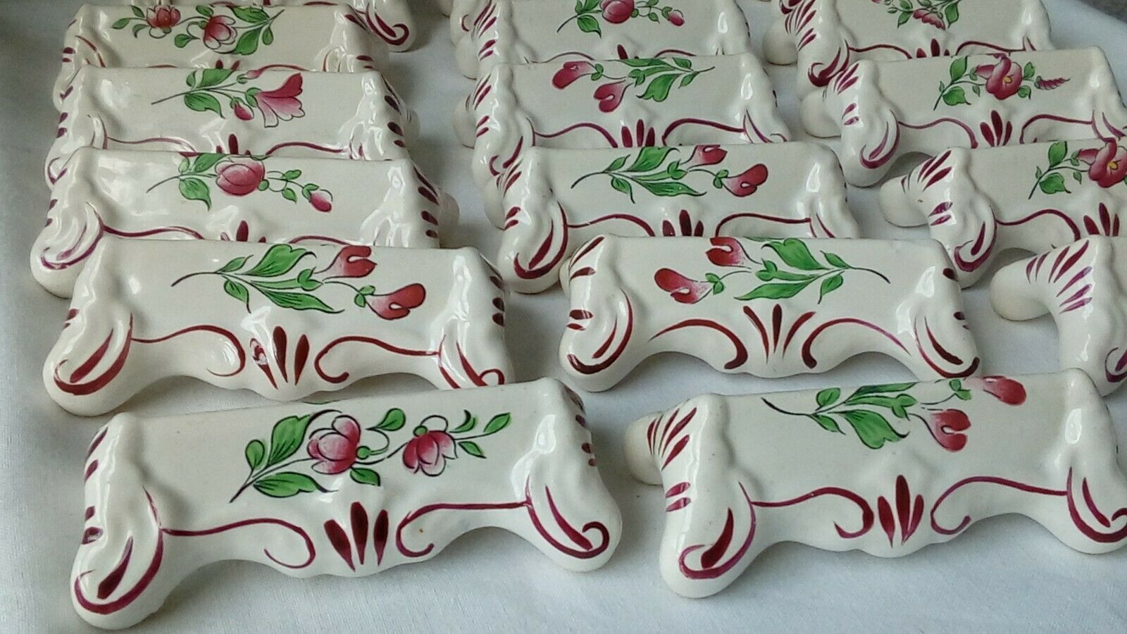 Suite of 18 knife holders in faience of luneville model reverbere