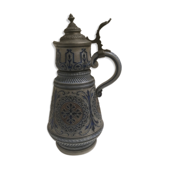 Old pitcher with beer or wine