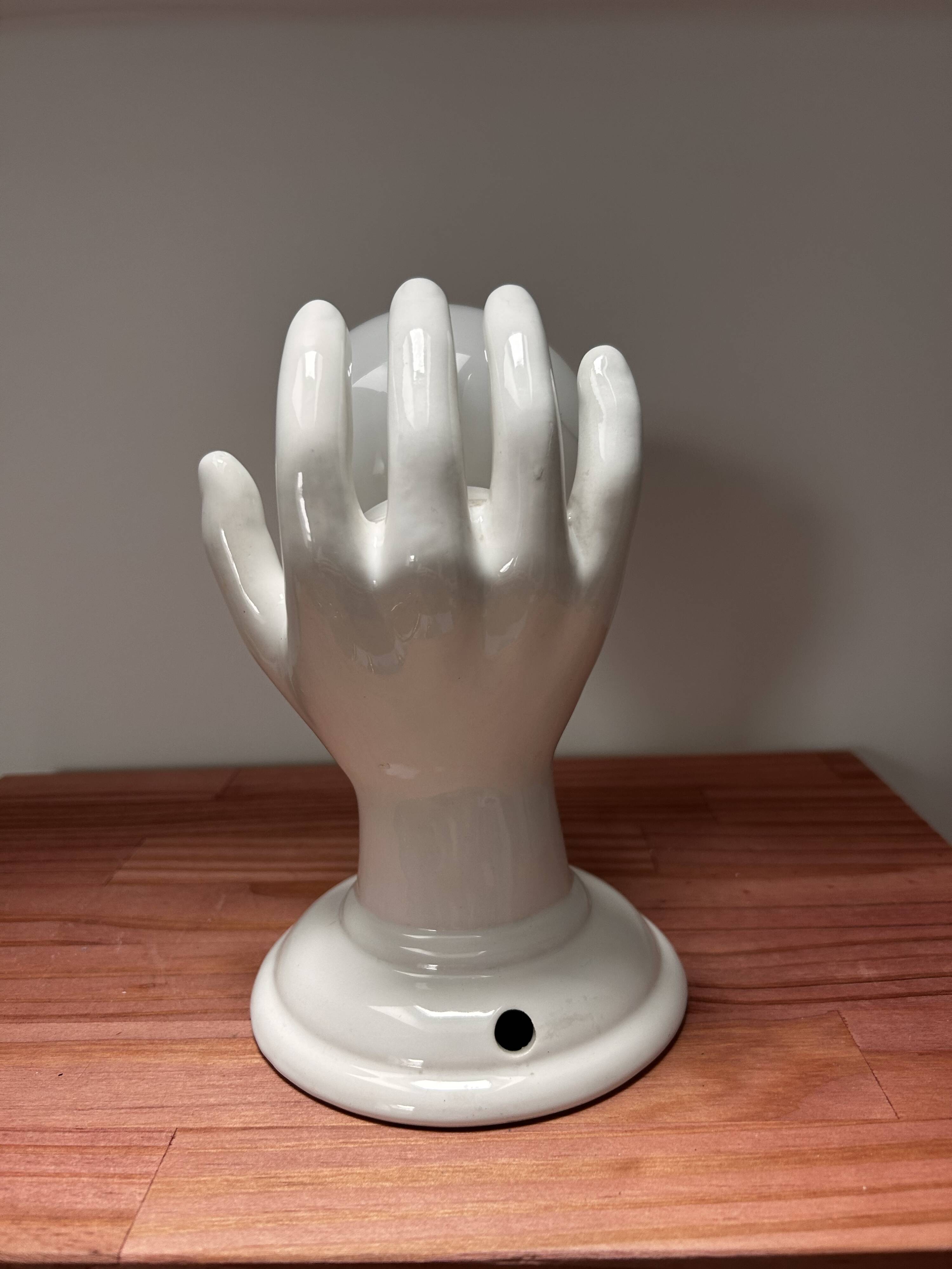 Ceramic hand wall light