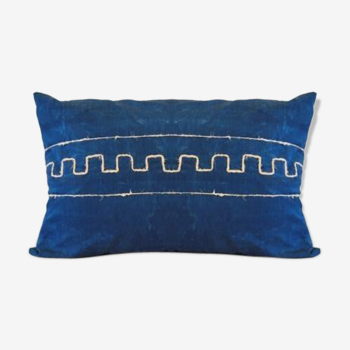 Cushion has Greek metis tie and dye pattern
