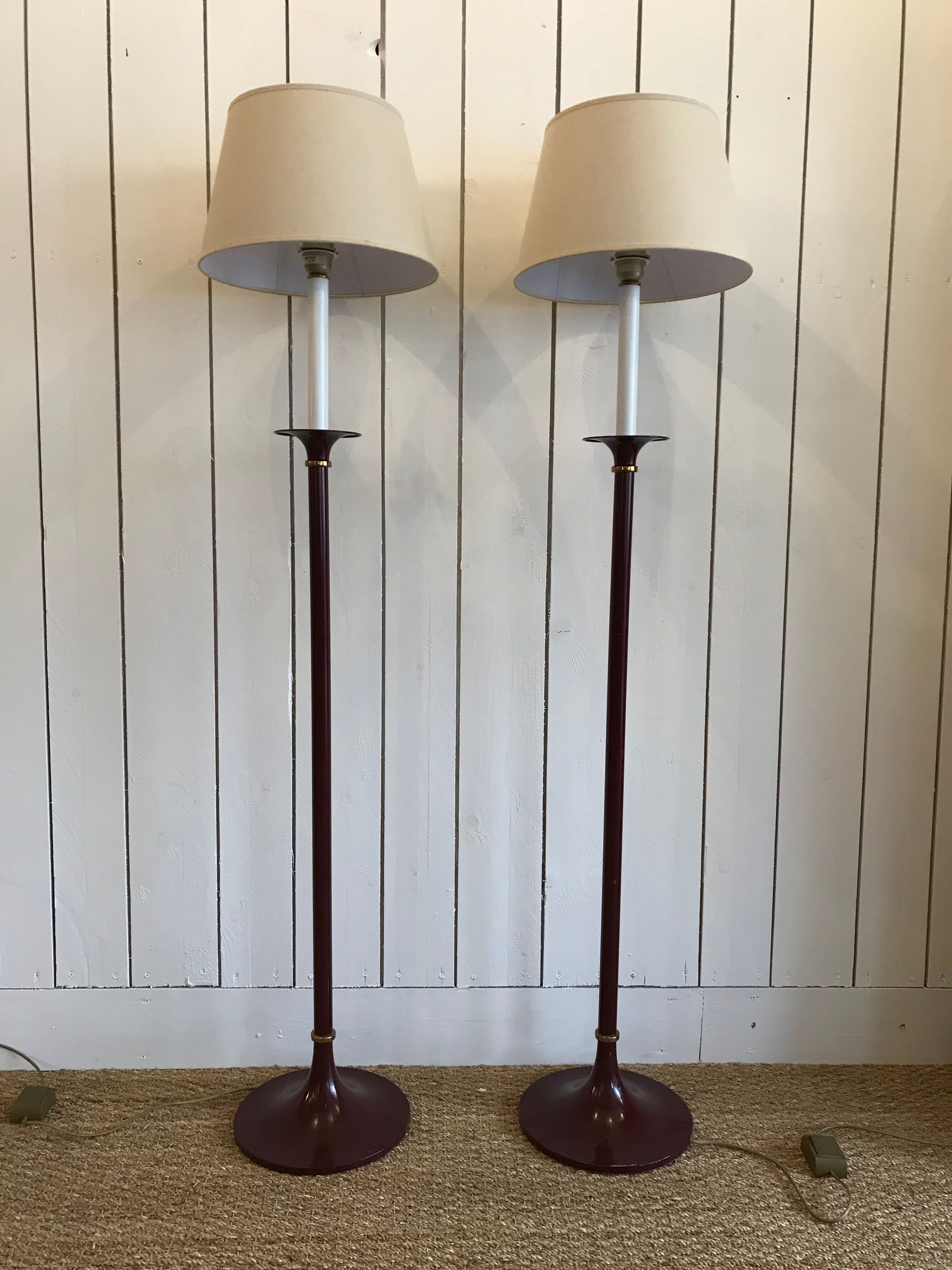 Pair of red enamelled metal floor lamps