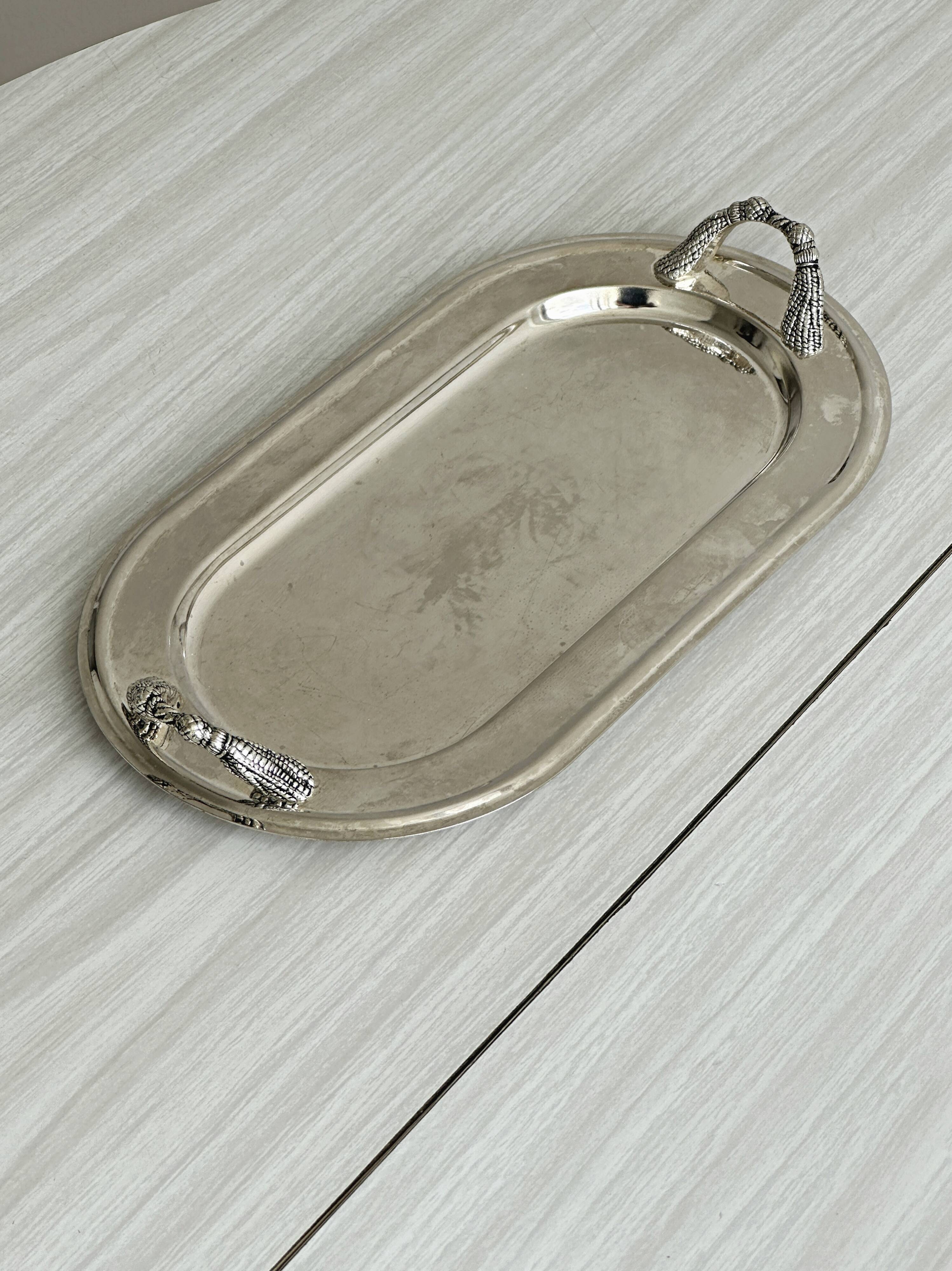 Vintage silver plateau with knot handles.