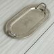 Vintage silver plateau with knot handles.