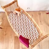 Vintage rattan pirogue cradle