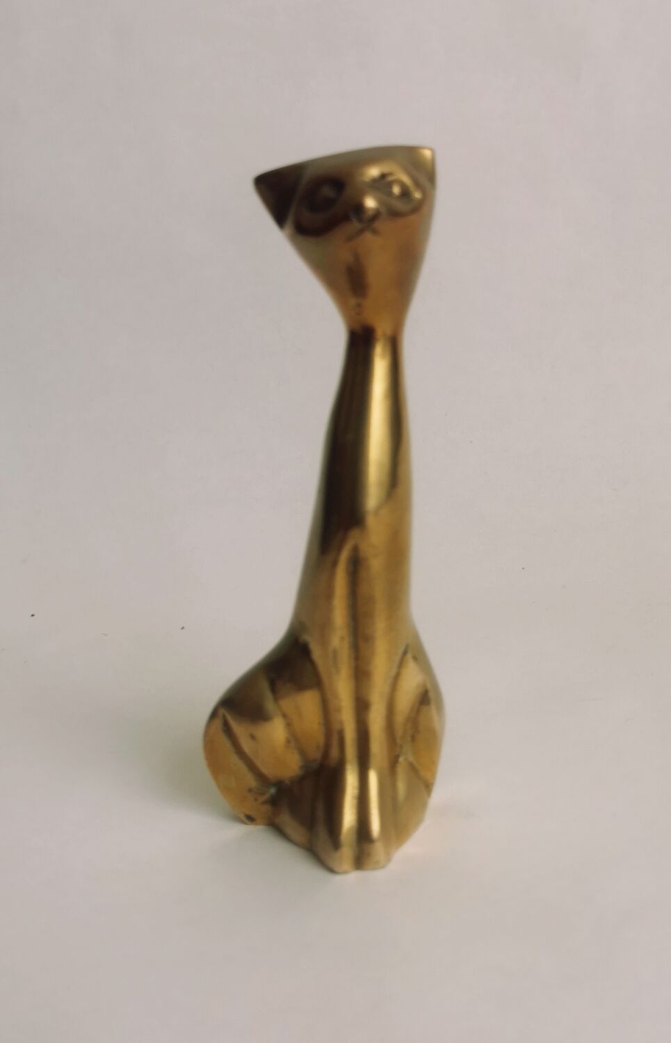 Trio of cats in gilded brass