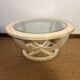 Oval patinated wood and beveled glass coffee table