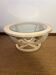 Oval patinated wood and beveled glass coffee table