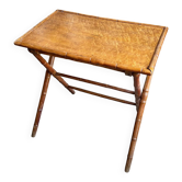 Folding table made of wood resembling bamboo.