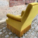 Fauteuil crapaud velours jaune moutarde à franges