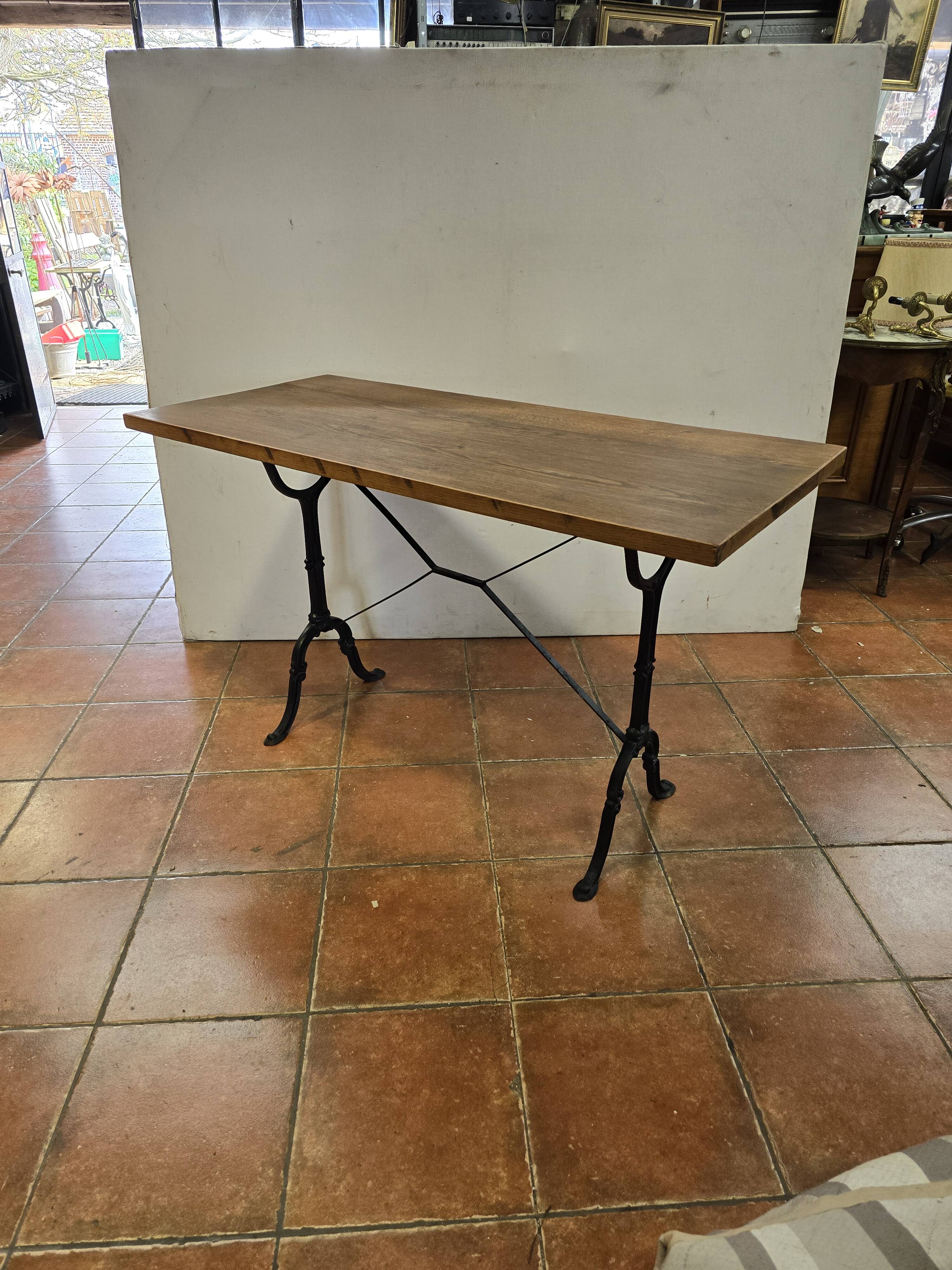 Old bistro table with oak top, cast iron base, 118 cm L