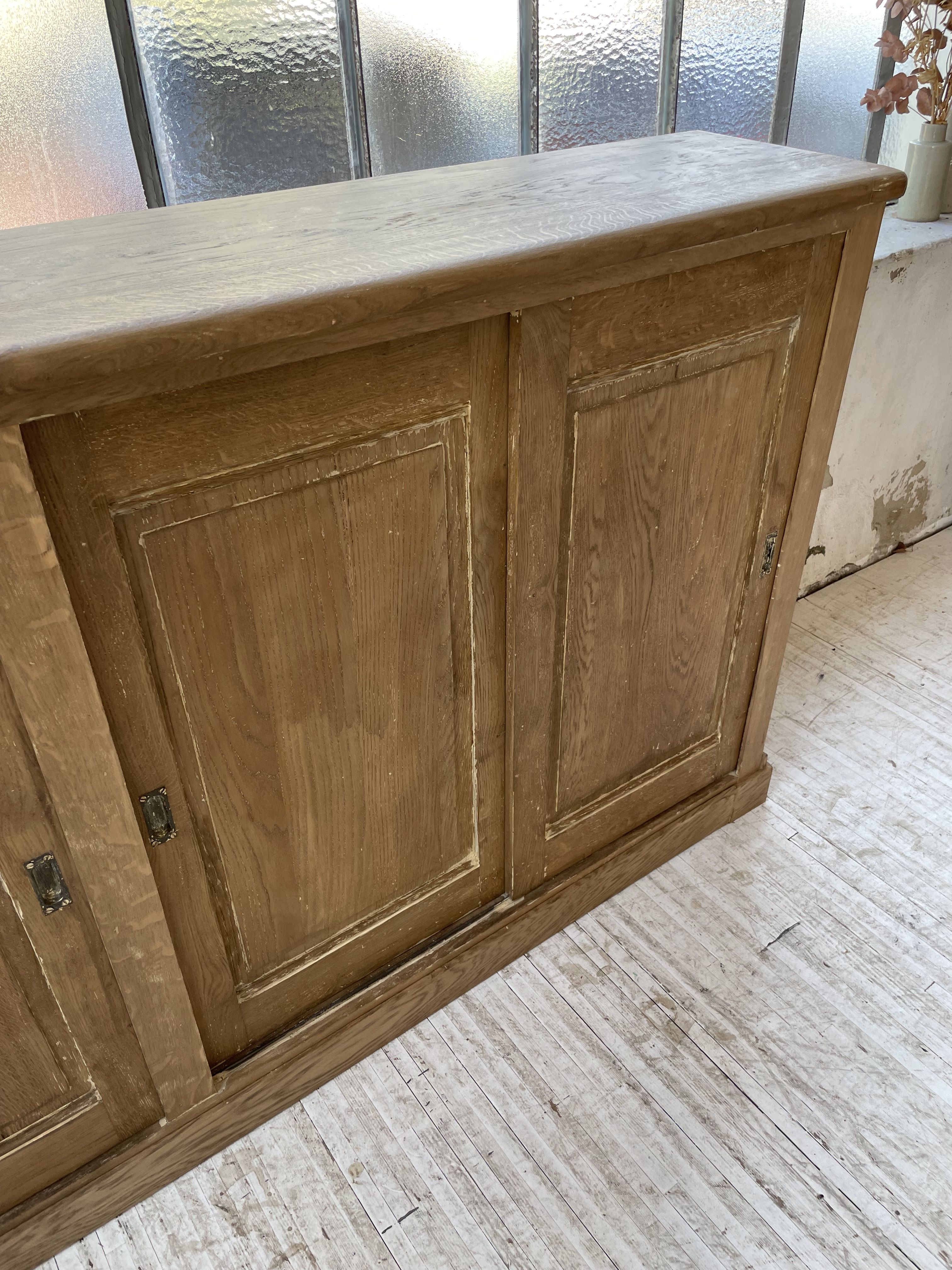 Large row of solid oak loom sliding doors