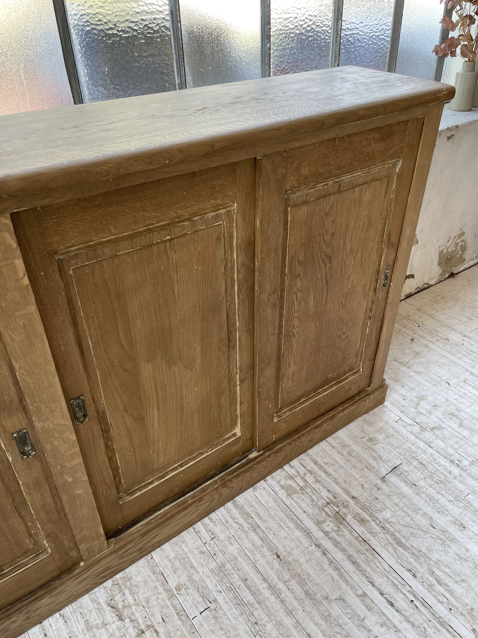 Large row of solid oak loom sliding doors