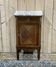 Nightstand in marquetry and white marble from the early 20th century.