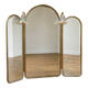 Vintage triptych mirror in brass with wall lights.